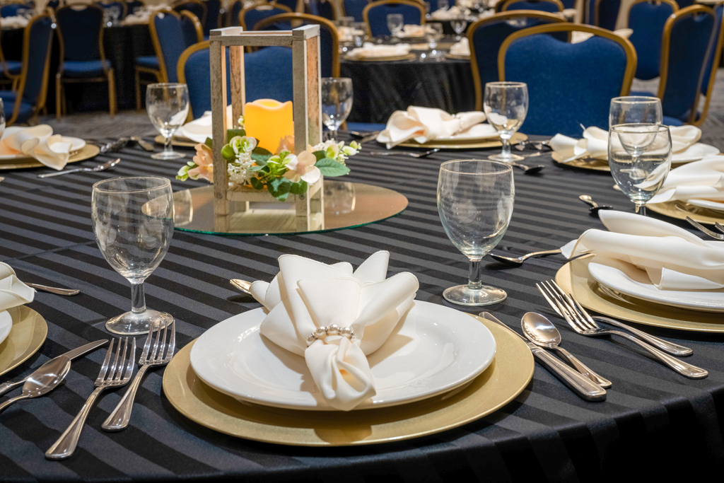 Large classroom-style conference room with presentation screen